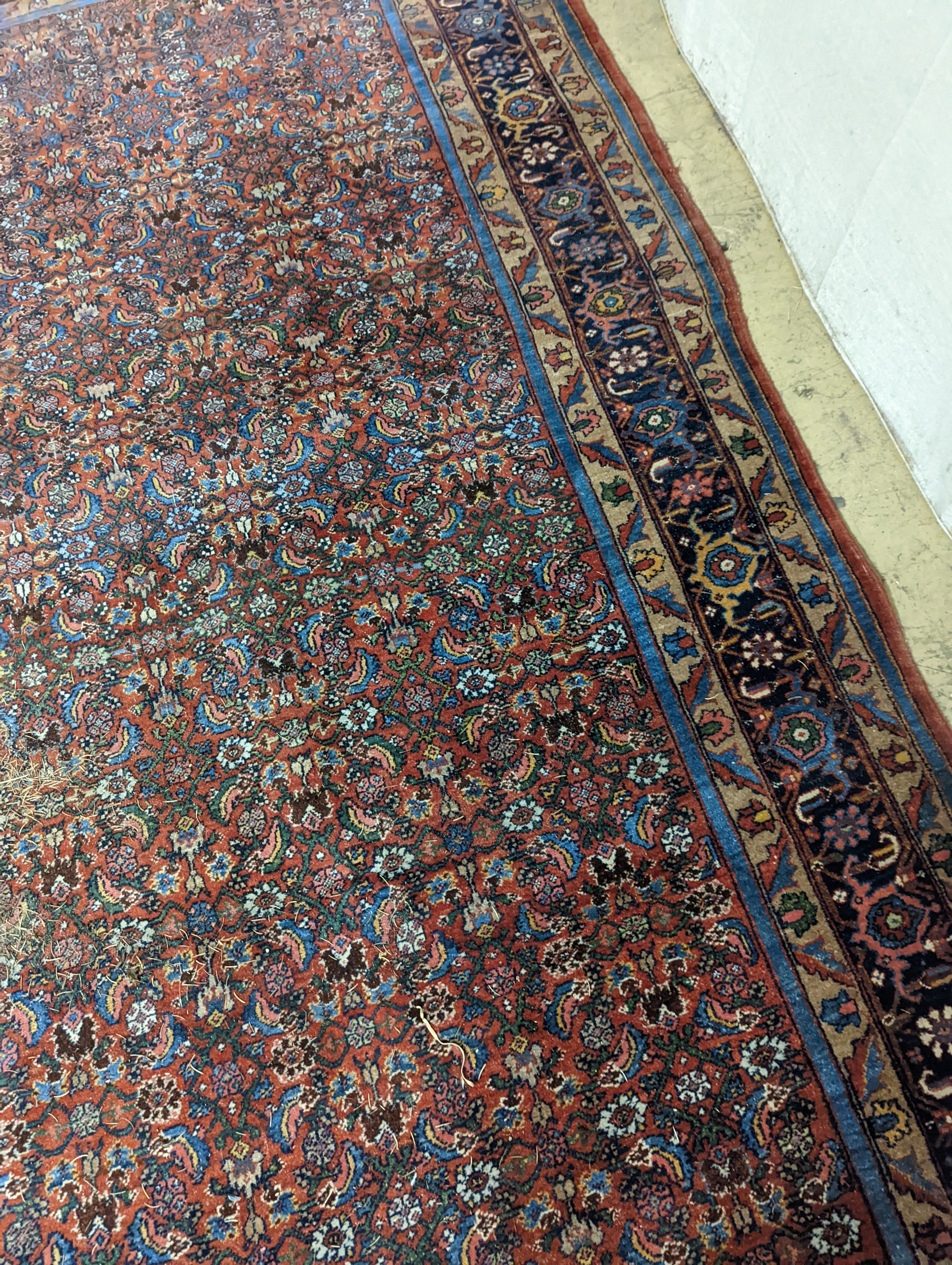 A North West Persian red ground carpet, 360 x 250cm